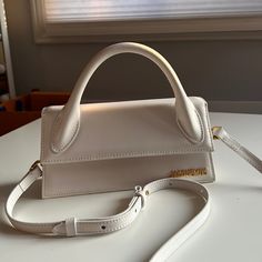 Long Leather Handbag - Reinforced Handle - Magnetic Flap Closure - Adjustable, Removable Strap - Interior Pocket - Gold Metal Logo And Hardware - Fully Lined - Painted Edges - 22 X 10.5 Cm Jacquemus Bag, Metallic Logo, Painting Edges, Bags Handbags, Leather Handbags, Gold Metal, Leather Bag, Bag Lady, Shoe Accessories