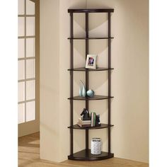 a corner shelf with several shelves and vases on it in the corner of a room