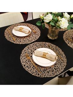 the table is set with gold place settings