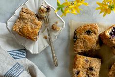 blueberry crumb bars on a plate with a fork