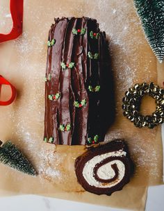 a piece of cake sitting on top of a table next to scissors and other decorations