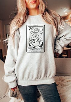 Grab this cute and celestial Hairstylist sweatshirt for yourself or for the amazing hair dresser in your life. This soft and cozy crewneck features a cute tarot card design and would make the perfect Christmas gift for any hairstylist! ABOUT THE PRODUCT: Unisex Heavy Blend™ Crewneck Sweatshirt | GILDAN 18000 (Customer Favorite) A sturdy and warm sweatshirt bound to keep you warm in the colder months. A pre-shrunk, classic fit sweater that's made with air-jet spun yarn for a soft feel and reduced pilling. * 50% cotton, 50% polyester * Pre-shrunk * Classic fit with no center crease * 1x1 athletic rib knit collar with spandex * Air-jet spun yarn with a soft feel and reduced pilling * Double-needle stitched collar, shoulders, armholes, cuffs, and hem The size chart is listed in photos above. P Salon Sweatshirt Ideas, Hairstylist Sweater, Hairdresser Shirts, Hair Dresser Outfits, Hairstylist Client Shirt, Hair Stylist Shirts, 2000s Clothing, Hairdresser Gift, Hair Stylist Gifts