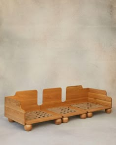 three wooden trays with holes in them