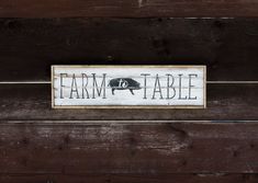 a wooden sign that says farm to table