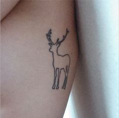 a small deer tattoo on the right thigh