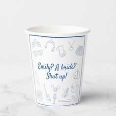 a white cup with blue writing on it that says, enjoy a bridal shut up