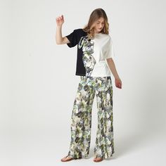 This timeless elegance and sophisticated t-shirt is the perfect choice for the woman who wants to look and feel her best, no matter where she goes. The applique of the t-shirt is the same fabric as our "Wide Pleated Pants In Abstract Print Linen" and "Linen Tiered Drawstring Skirt With Trims Of Lace Appliques".  Paired with our linen pants or skirts, they are sure to turn heads and make lasting impressions. Care: Dry Clean Composition: 80% Viscose 20% Polyester Pleated Pants, Printed Linen, Fine Jewelry Gift, Gifts For New Mums, Lace Applique, Mens Jewelry Bracelet, Linen Pants, Abstract Print, Independent Designers Fashion