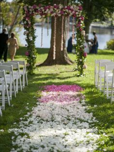 the aisle is decorated with flowers and petals