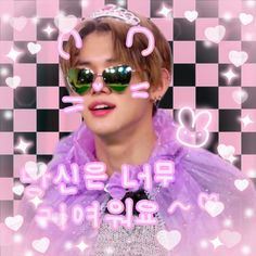 a man wearing sunglasses and a tiara in front of a checkerboard background