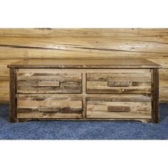 a large wooden dresser sitting on top of a blue carpet