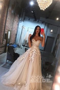 a woman taking a selfie in a wedding dress