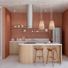 a kitchen with two stools in front of the counter and an island next to it