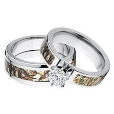 two wedding rings that are made out of realtree camo and one has a diamond in the center