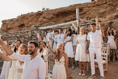 a group of people that are standing in the dirt