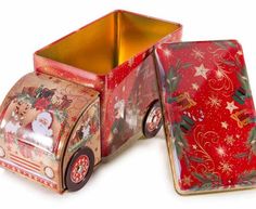 an old fashioned tin toy truck with christmas decorations on it's front and side