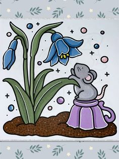 an elephant is sitting in the dirt next to a flower