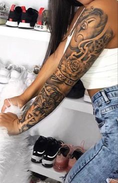 a woman with a tattoo on her arm