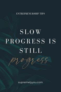 the words slow progress is still progress written in gold on a black background with green leaves