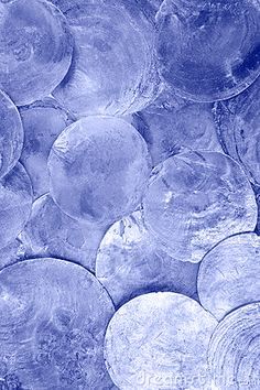 a blue background with lots of glass discs