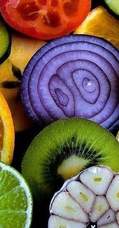 an assortment of fruits and vegetables cut in half