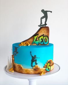 a birthday cake with a skateboarder on top