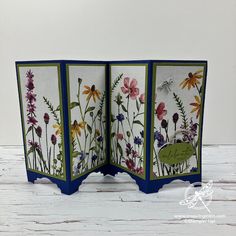 an open card with flowers on it