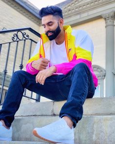 a man sitting on steps with his feet crossed