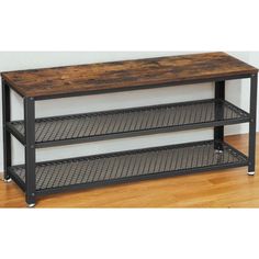 a wooden table with metal shelves on it