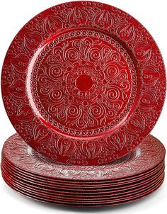 red plates stacked on top of each other with intricate designs in the center and bottom