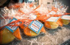 orange and yellow candies wrapped in plastic bags