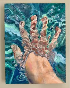 a painting of a person's hand in the water with blue and green colors