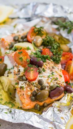 salmon with olives, tomatoes and capers on foil