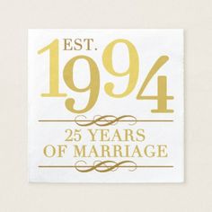 a white and gold square sticker with the words, est1994 years of marriage