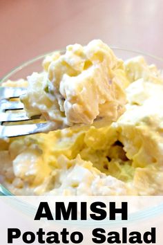 a close up of a fork with potato salad on it and the text amish potato salad