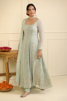 Ice blue georgette padded anarkali with floral, geometric stripe pattern chikankari thread embroidery, square neck, sequin and gota embellishment. Paired with semi crepe pant and embroidered dupatta.
Components: 3
Pattern: Embroidered and Embellished
Type Of Work: Chikankari, Sequin and Gota Work
Neckline: Square Neck
Sleeve Type: Full Sleeves
Fabric: Georgette, Pant: Semi Crepe, Lining: Semi Crepe
Color: Blue
Other Details: 
Piping details on neckline
Deep U back
Attached lining
Anarkali Closur Square Neck Anarkali, Anarkali Kurti Design, Suit Designs Indian Style, Anarkali Designs, Embroidery Square, Designer Anarkali Dresses, Long Frock Designs, Trendy Outfits Indian, Churidar Designs