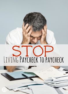 a man sitting at a desk with his head in his hands and the words stop living paycheck to paycheck