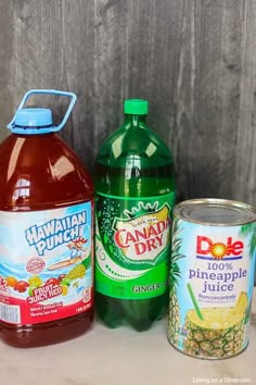 three different types of juices on a table next to each other, including pineapple juice and hawaiian punch