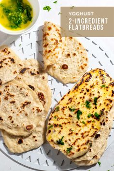 2 Ingredient flatbreads on a white tray with a bowl of parsley butter to the side. Flavoured Butter, Curry Recipes Easy, Flatbread Recipe, Easy Homemade Pizza, Easy Curry, Flavored Butter, Nigella Seeds, Herbs Spices, Flatbread Recipes