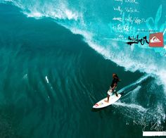 a man riding a wave on top of a surfboard