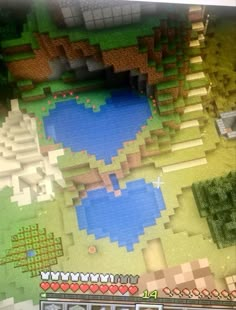 an aerial view of a lake surrounded by trees and bushes in minecraft, showing the location where it is located