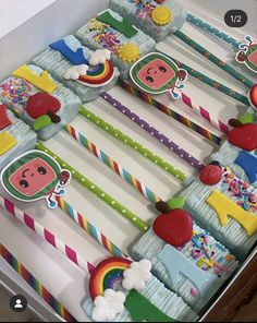 a cake in the shape of a train with lots of decorations on it's sides