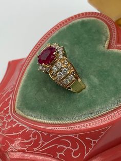 Ruby Ring With Baguette Cut For Anniversary, Anniversary Ruby Ring With Baguette Cut, Vintage Ruby Ring With Accent Stones, Vintage Ruby Ring With Accent Stones For Anniversary, Wedding Ruby Cluster Ring With Diamond Accents, Vintage Ruby Birthstone Ring With Accent Stones, Timeless Ruby Ring With Halo Setting As A Gift, Vintage Ruby Ring With Accent Stones For Formal Occasions, Ruby Rings With Baguette Cut For Anniversary