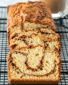 a loaf of cinnamon swirl bread on a cooling rack