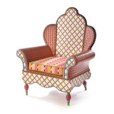 an upholstered chair with pink and green accents