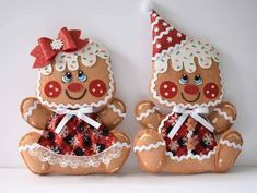 two decorated gingerbread bears sitting next to each other