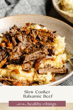 slow cooker balsamic beef on top of mashed potatoes in a bowl