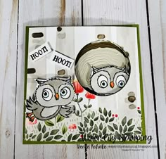 an owl card made with stamping and watercolors on white wood planks