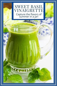 a green smoothie in a glass pitcher with basil leaves around it and the words sweet basil vinaicette capture the flavors of summer in a