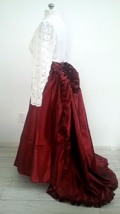 Gorgeous Red Satin Victorian Bustle Skirt With Train suitable for Steampunk, Edwardian, Historical Dress, & Weddings! Made of Satin material with ruffles at the bum with an attached train. Concealed side zipper with tie waist. GARMENT CARE Dry Clean or and Wash in Cold Water To add the corset belt; https://www.etsy.com/listing/921547733/corset-belt-elvin-fairy-pixie-goth?click_key=ba57ea81d19de802df60d10a5948a8827208abe3%3A921547733&click_sum=9f394b5f&ref=shop_home_active_1&crt=1&sts=1 Petticoat Red Fitted Victorian Dress For Party, Victorian Satin Dress With Ruffles For Costume, Red Fitted Ruffled Skirt, Fitted Ruffled Skirt For Costume Party, Fitted Red Ruffled Skirt, Red Fitted Ruffle Skirt, Steampunk Ruffled Skirt For Party, Vintage Ruffled Skirt For Costume Party, Vintage Ruffle Skirt For Costume Party