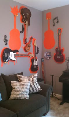 a living room with guitars on the wall